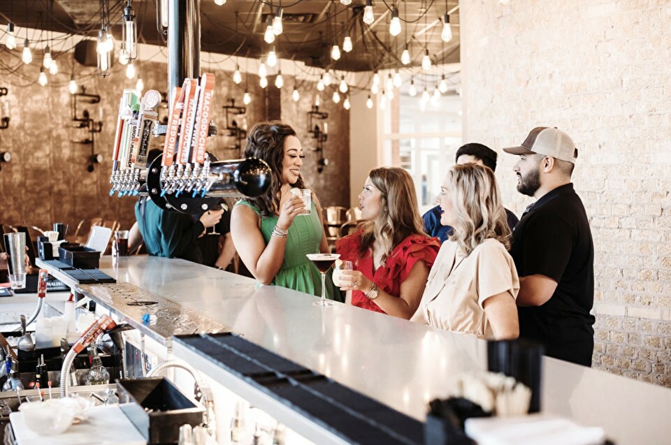 People networking at a local bar