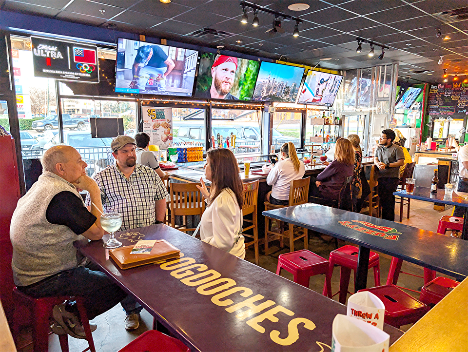 People networking at a local taco shop