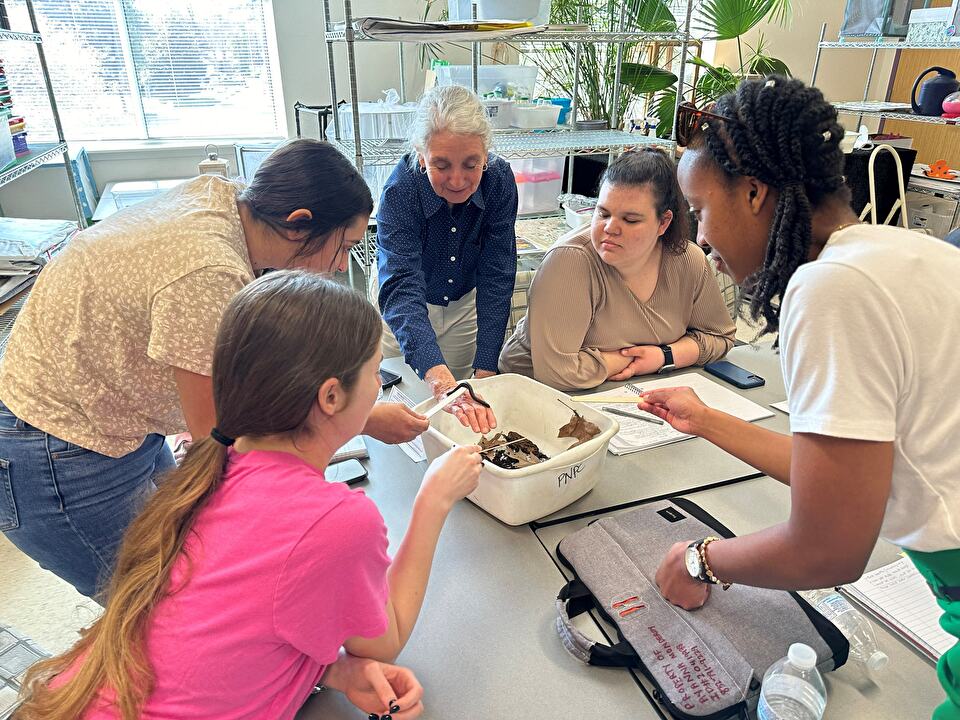 SFA Gardens Environmental Education Programs Coordinator trains SFA students.