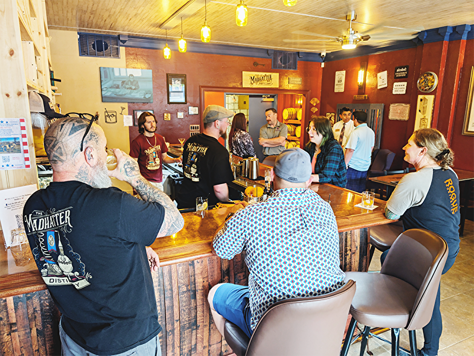 People networking at a local distillery