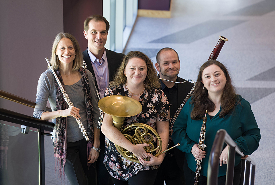 Photo of quintet members on a stairway