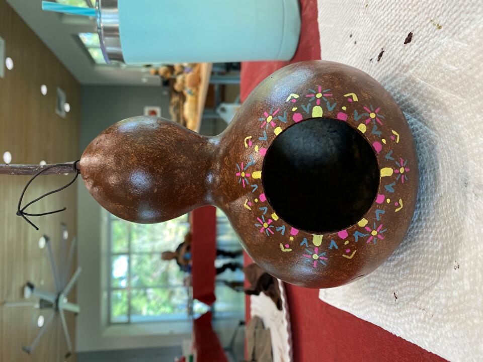 A decorated birdhouse gourd.