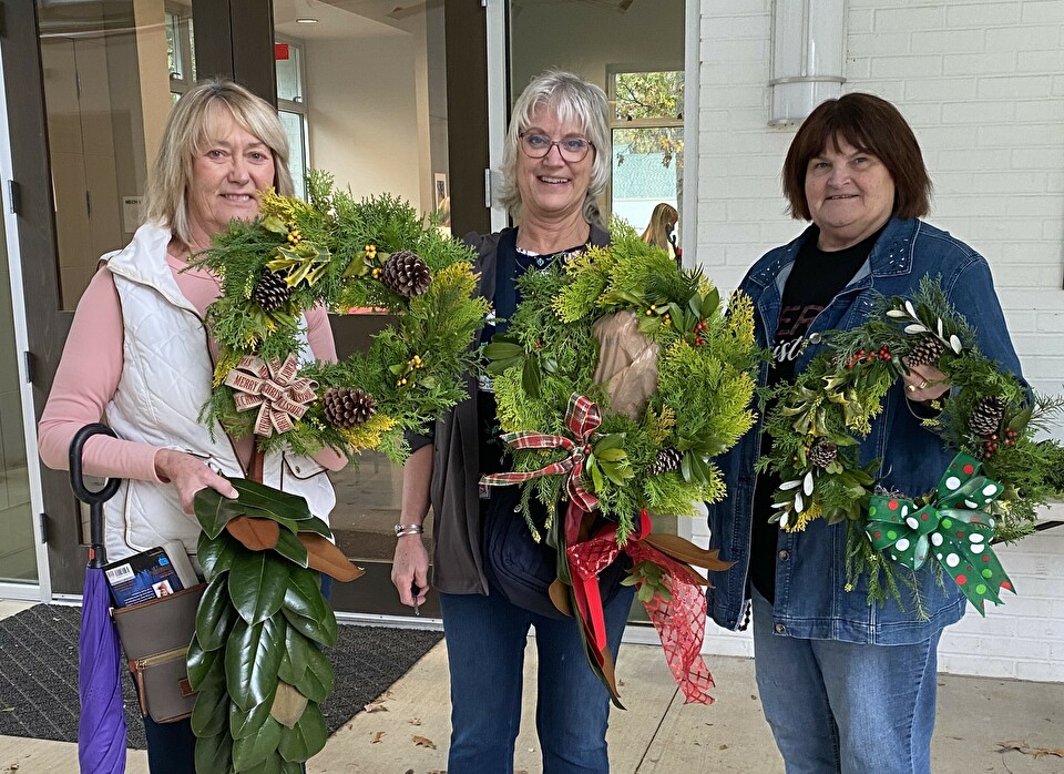 Photo of participants and their holiday wreaths
