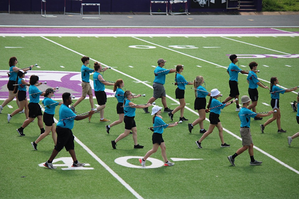 drum major campers marching on football field