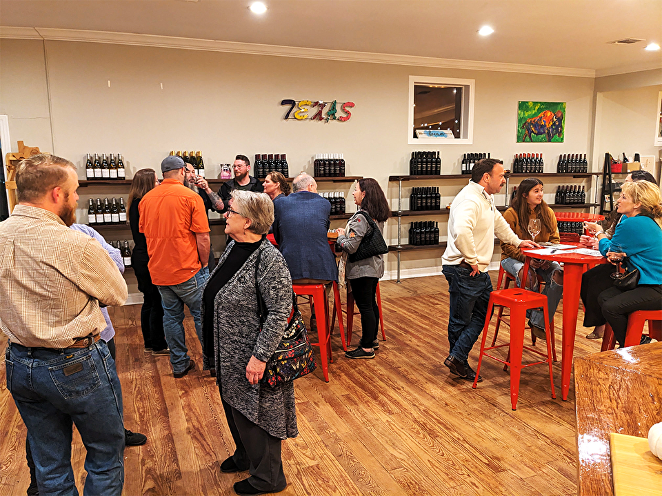 People networking at a local winery