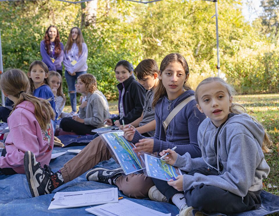 Students attending an activity station at Wild About Science