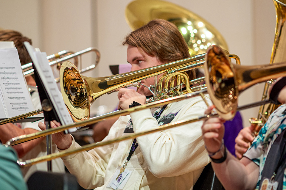 band camper playing trombone